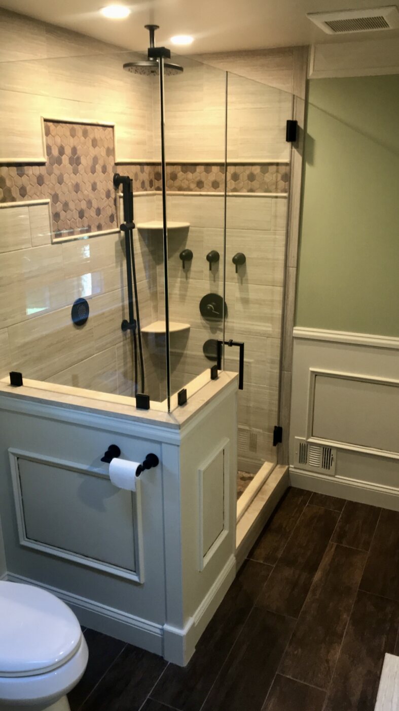 Bathroom 3 tiled shower with frameless glass and black fixtures