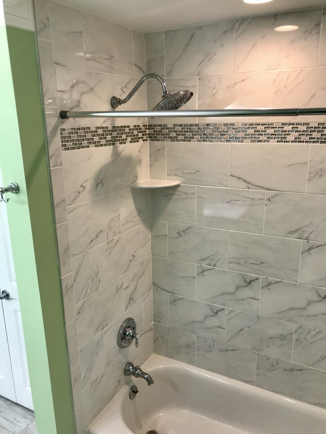 Bathroom 5 rain shower and mosaic accent detail