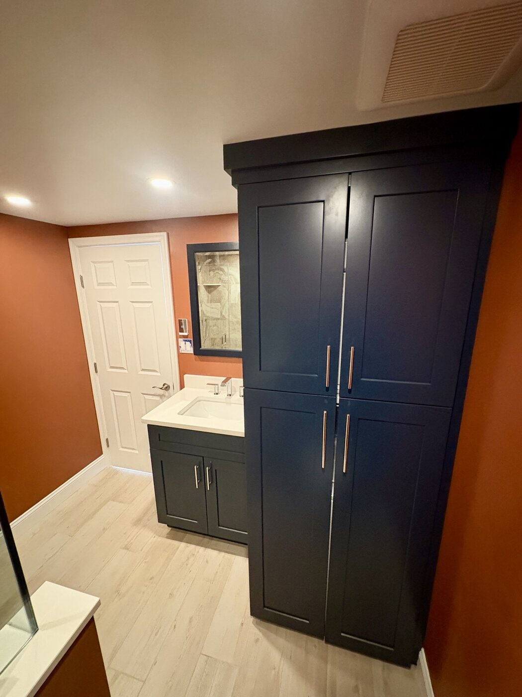 Bathroom 1 tall built-in storage and matching vanity