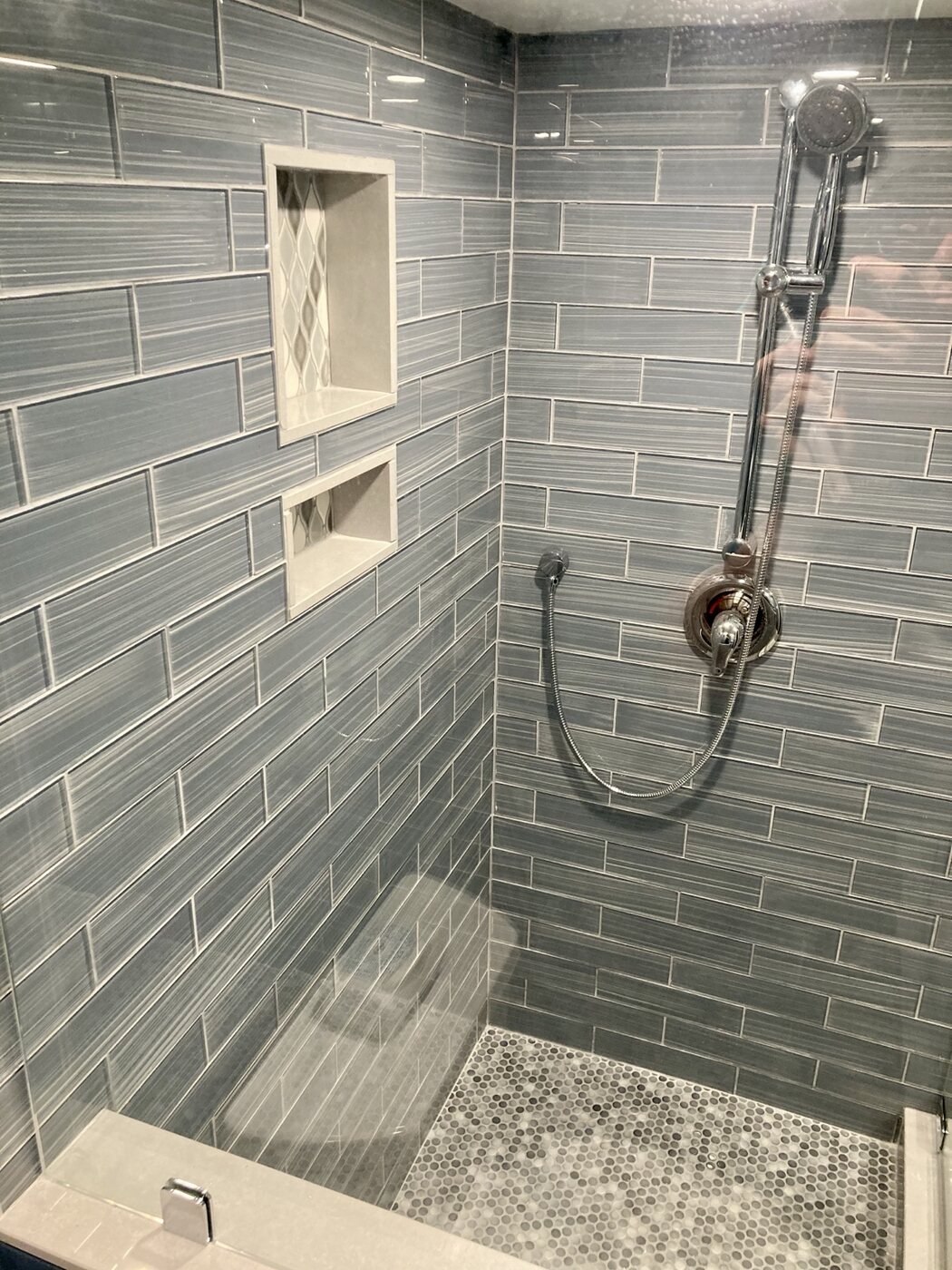 Bathroom 2 custom tiled shower with niches and handheld fixture