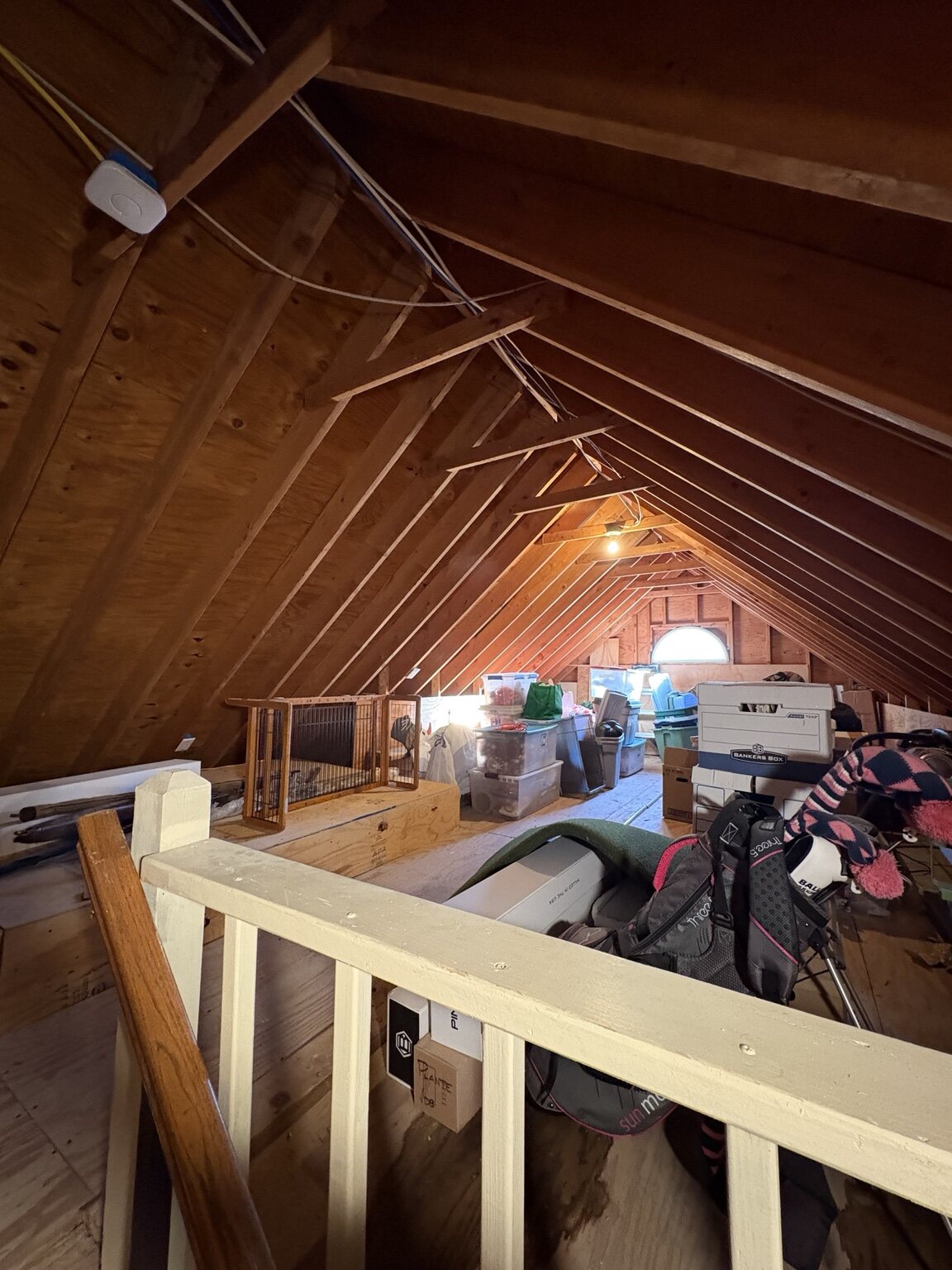 Unfinished garage loft before conversion