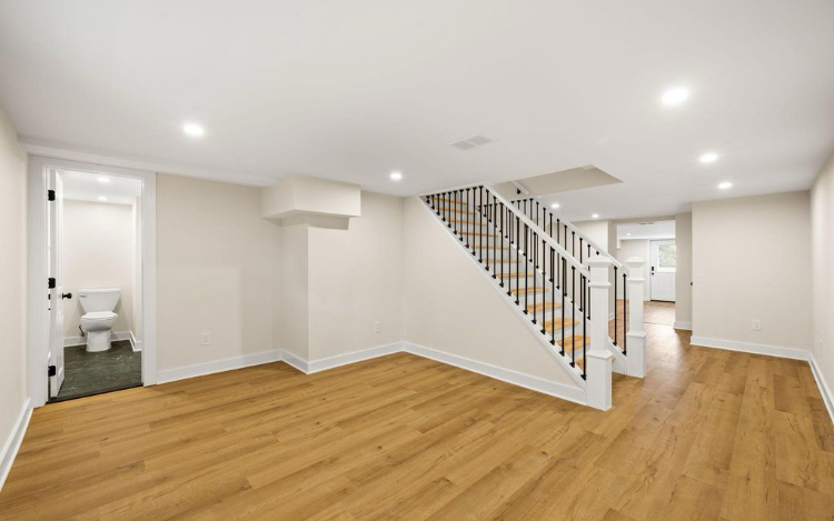Finished lower-level living area and staircase